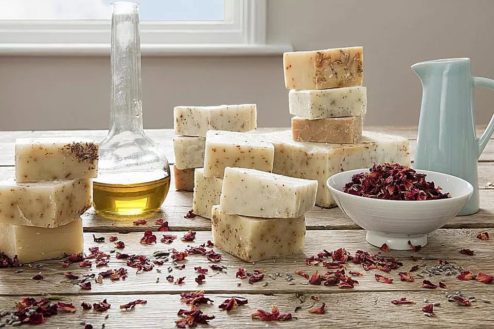 Handmade soap bars with natural oils and dried rose petals